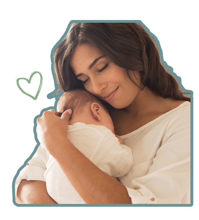 A woman lovingly holding a small newborn against her chest