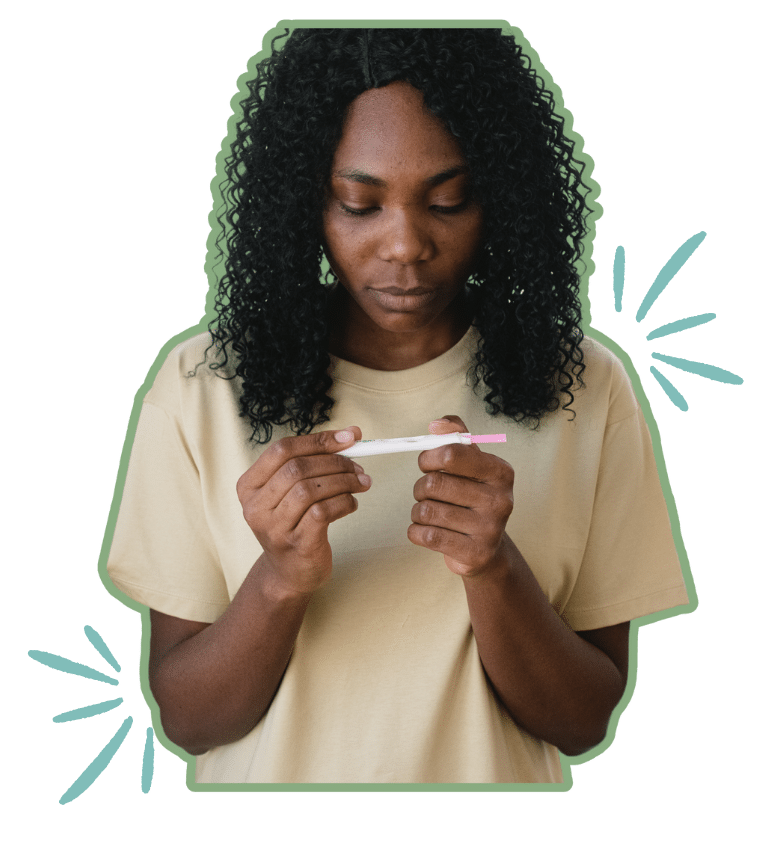 Girl looking at a pregnancy test